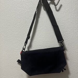 Unisex 12”x7” Slim Black Crossbody Bag.Adjustable strap.New.Never used.